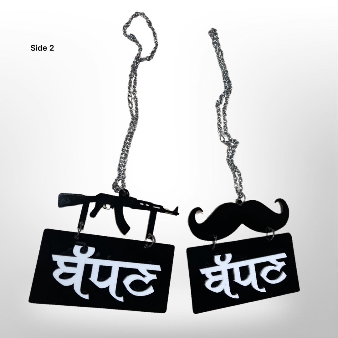 "Badhan" car hanger - moustache/gun