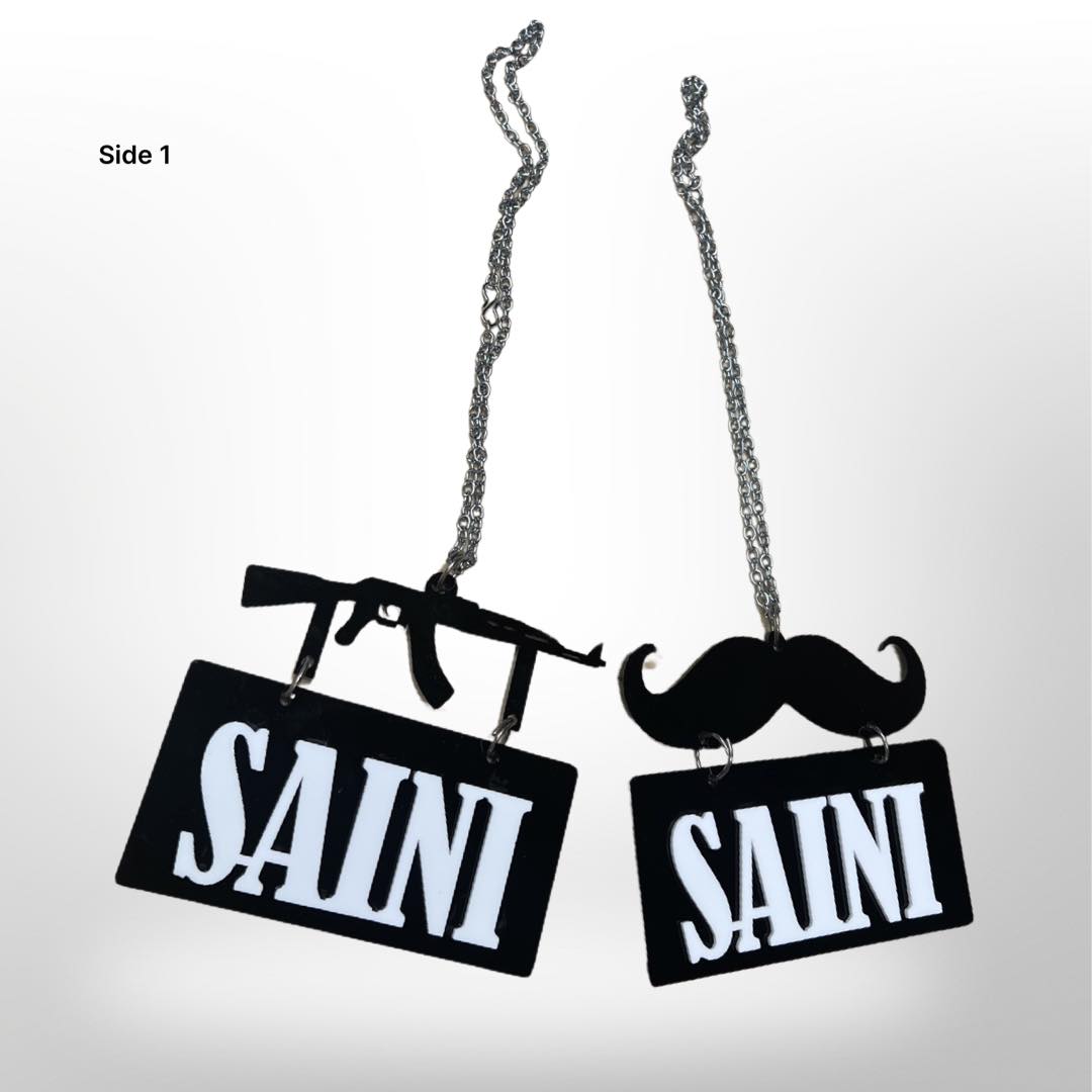 "Saini' car hanger - moustache/gun