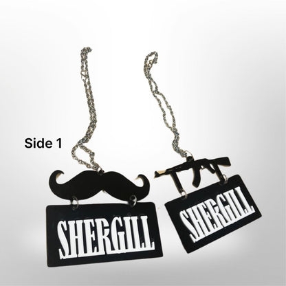 Cintre de voiture "Shergill" - moustache/pistolet